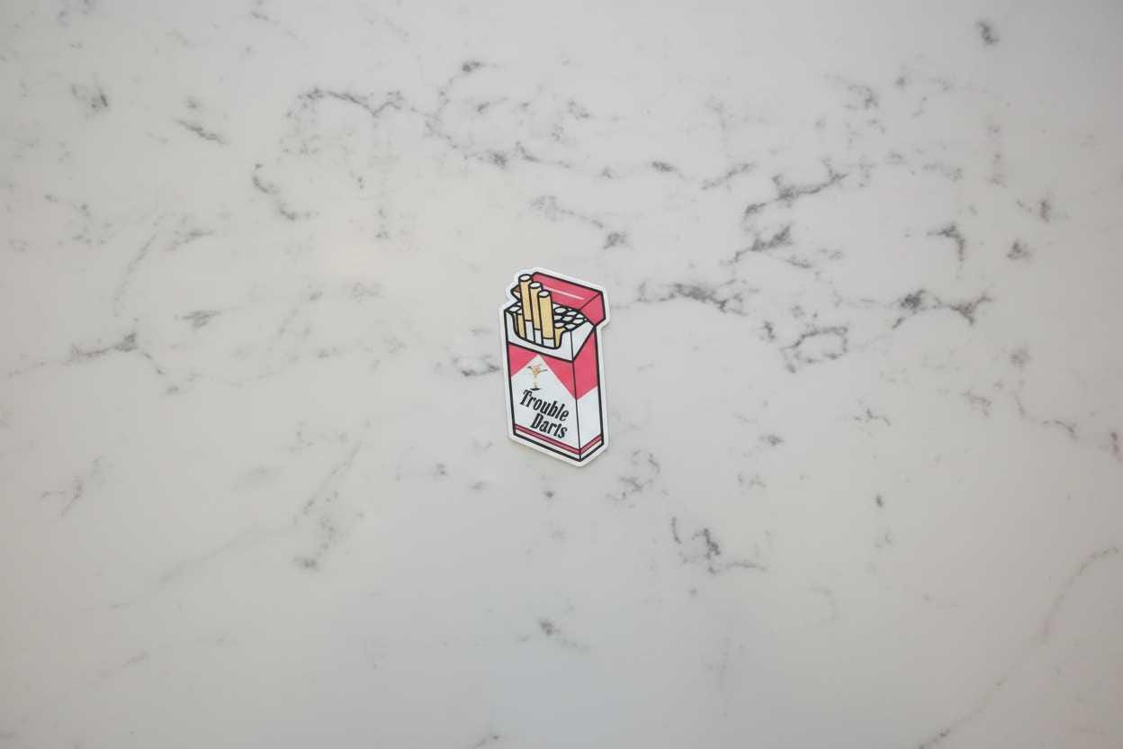 Red and White Trouble Darts Cigarette Pack Vinyl Sticker | 2x2