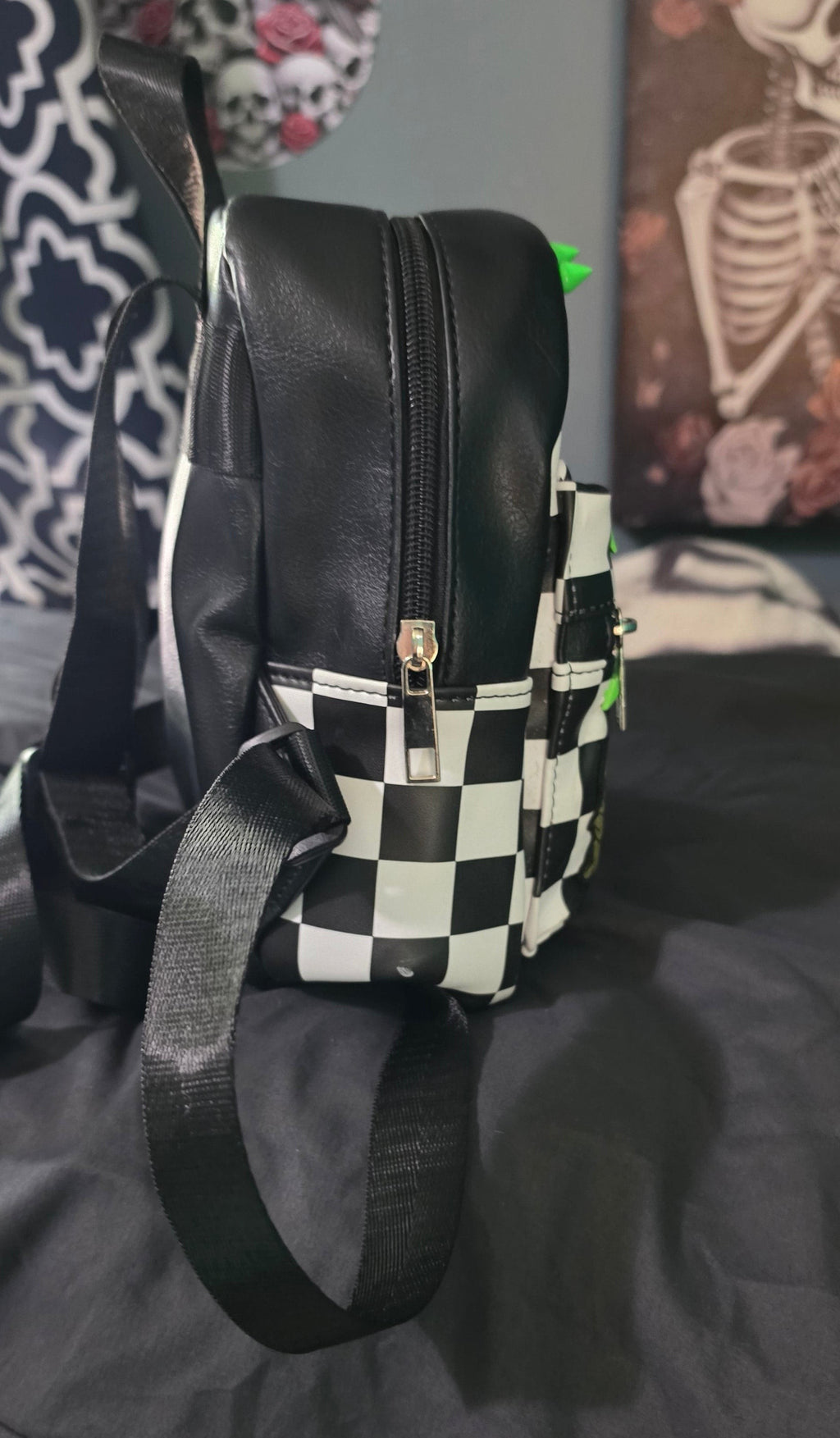 Hempin Mayhem mini backpack in black and white checkered faux leather with neon green spike studs and side view