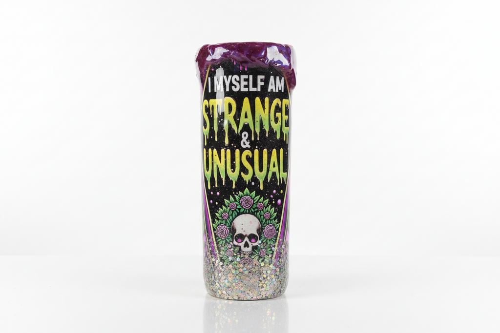 Tumbler with text 'I myself am strange and unusual' on a white background