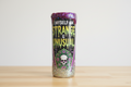 Tumbler with 'Myself I Am Strange & Unusual' text and skull design on a white background